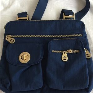 Baggalini blue Sydney crossbody bag.